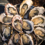 Get Shucked - Bruny Island Oysters. Photography by Rob Burnett. Image via Tourism Tasmania