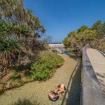 Swimming Eli Creek, Fraser Island. Image supplied by Tourism and Events Queensland.