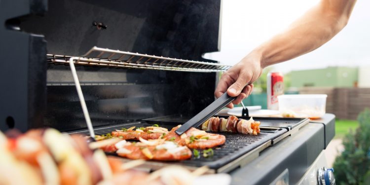 Grilling on BBQ. Photographed by Simon Kadula. Image via Shutterstock.