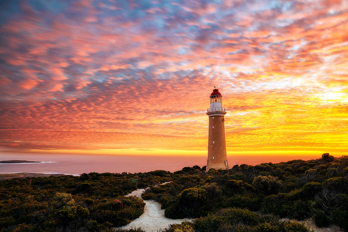 Cape Du Couedic Lighthouse Sunset. Image via Shutterstock, Photographed by Leah Kennedy.