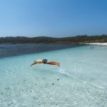 Diving Into Lake McKenzie. Supplied by Tourism and Events Queensland. Photographed by Reuben Nutt.