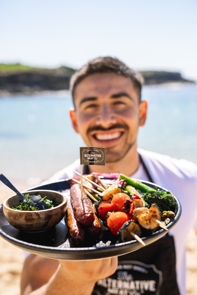 Jono Castano with his plant-based plate of barbecued Alternative Meat Co. sausages. Image: Supplied