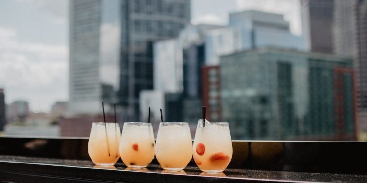 Rooftop drinks. Photographed by Kelly Sikkema. Image via Unsplash