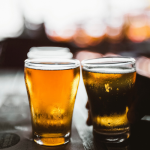 Two beers on a table.