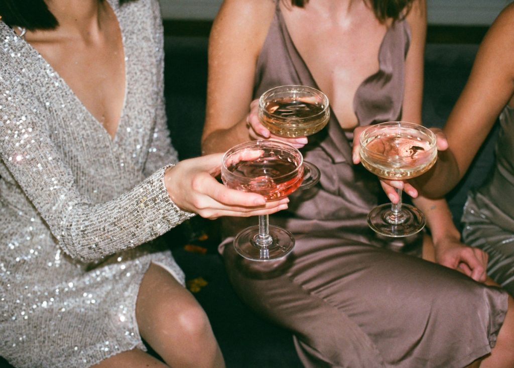 Women in party dresses. Image by Inga Seliverstova via pexels.