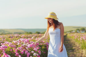 Woman in Rose Farm. Photographed by FabrikaSimf. Image via Shutterstock