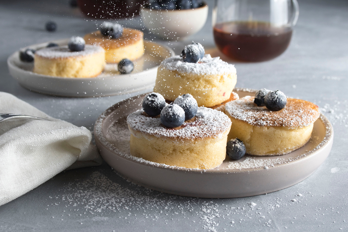 Fluffy Japanese Style Soufflé Pancakes Recipe. Photographed by Larisa Klassen. Image via Shutterstock.