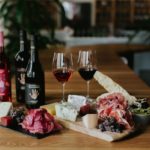 charcuterie board and red wines. photographed by Tony Mott. Image supplied