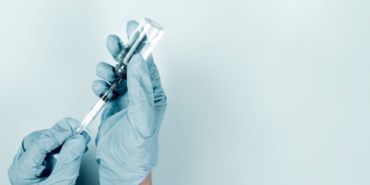 Pfizer vs AstraZeneca – What Australians Want for COVID Vaccine Rollout. Photographed by golibtolibov Getty Images. Image via Canva.
