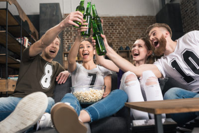 Low Alcohol Beer with friends. Photographed by LightField Studios. Image via Shutterstock
