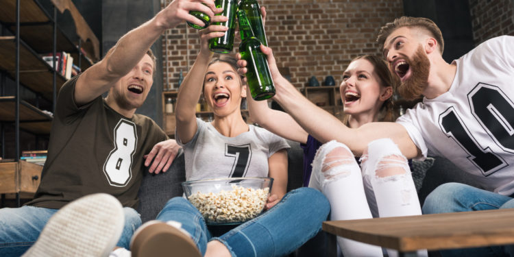 Low Alcohol Beer with friends. Photographed by LightField Studios. Image via Shutterstock