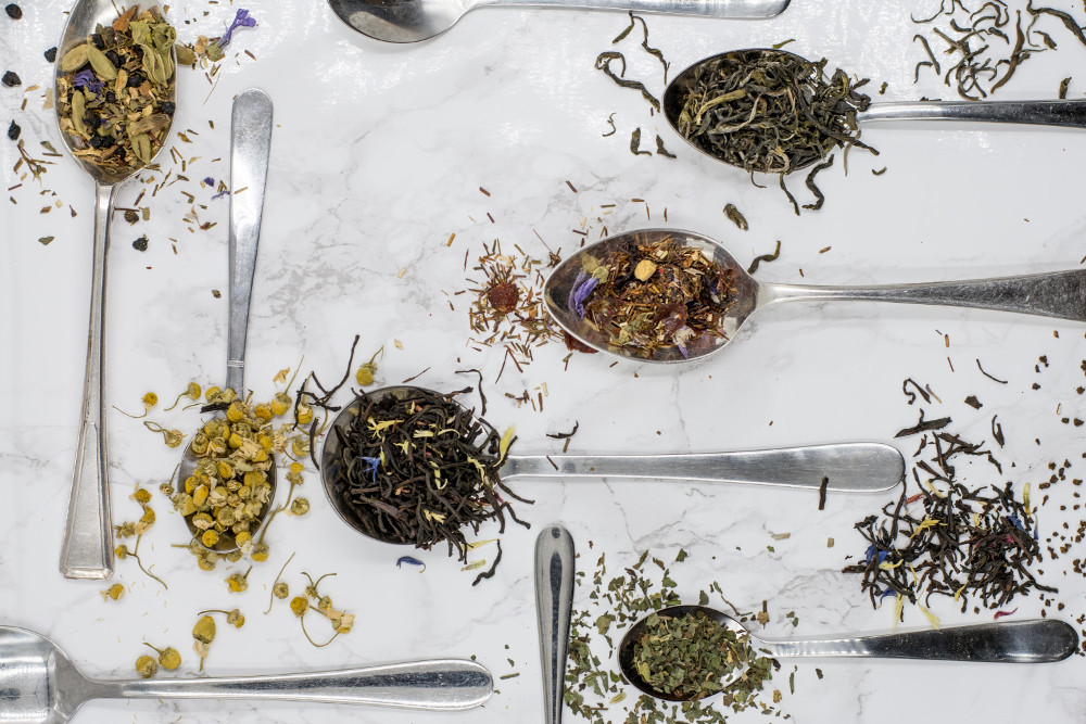 Tea selections on teaspoons. Photographed by Alice Pasqual. Image via Unsplash