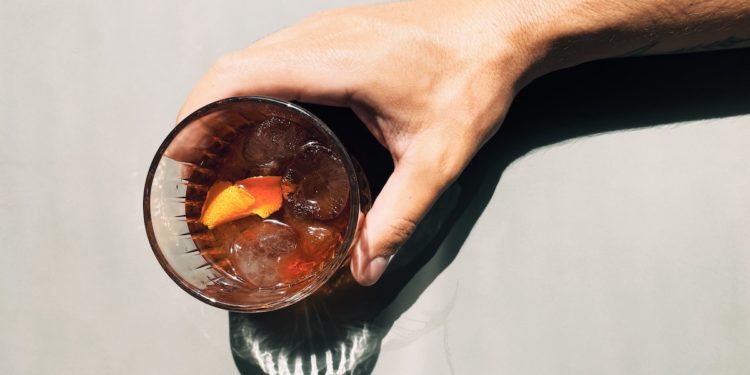 3 Ways to Participate and Celebrate Negroni Week 2021 At Home. Photographed by Matheus Frade. Image via Unsplash