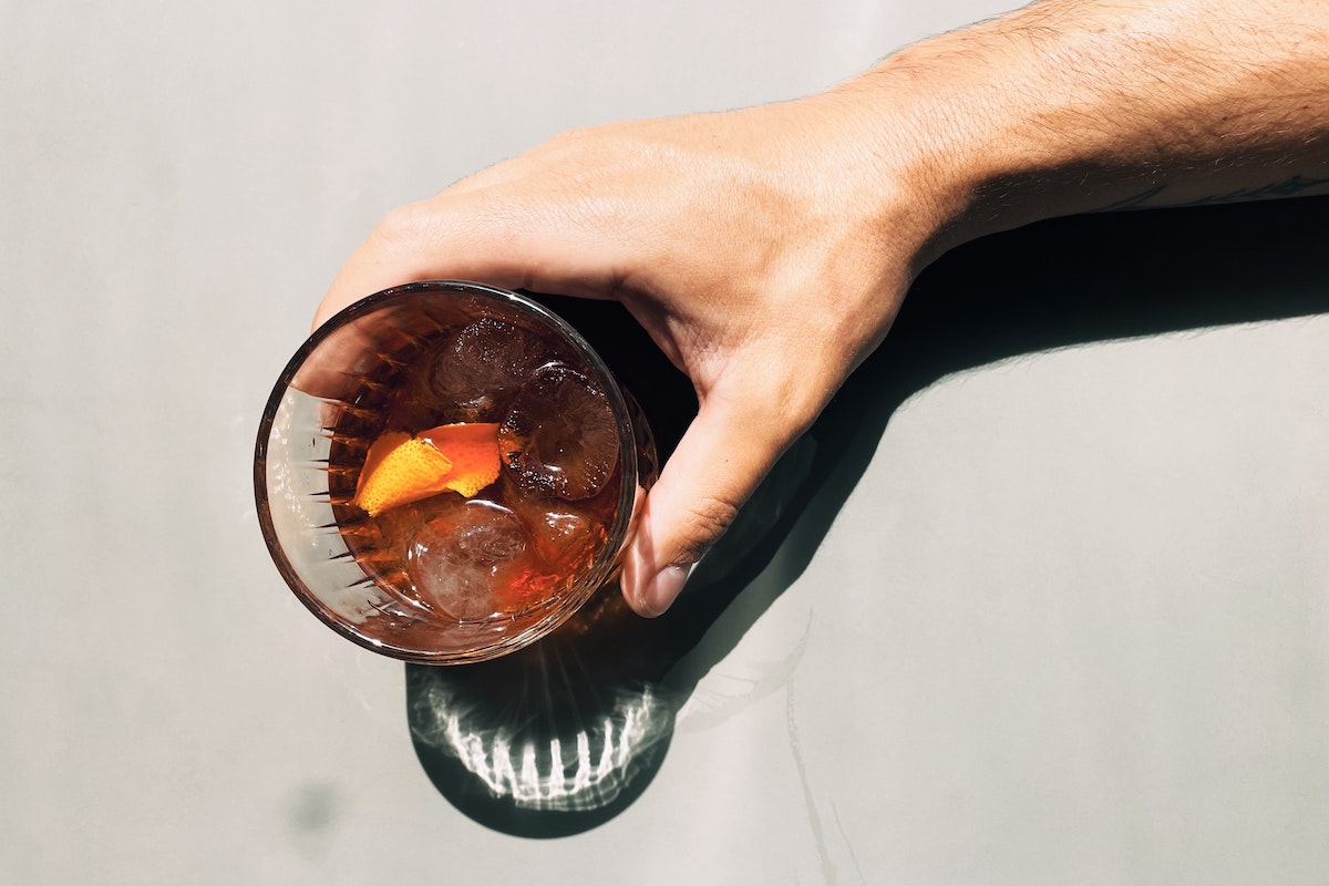 3 Ways to Participate and Celebrate Negroni Week 2021 At Home. Photographed by Matheus Frade. Image via Unsplash