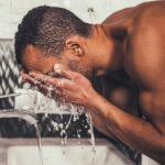 Man washing face skincare routine men