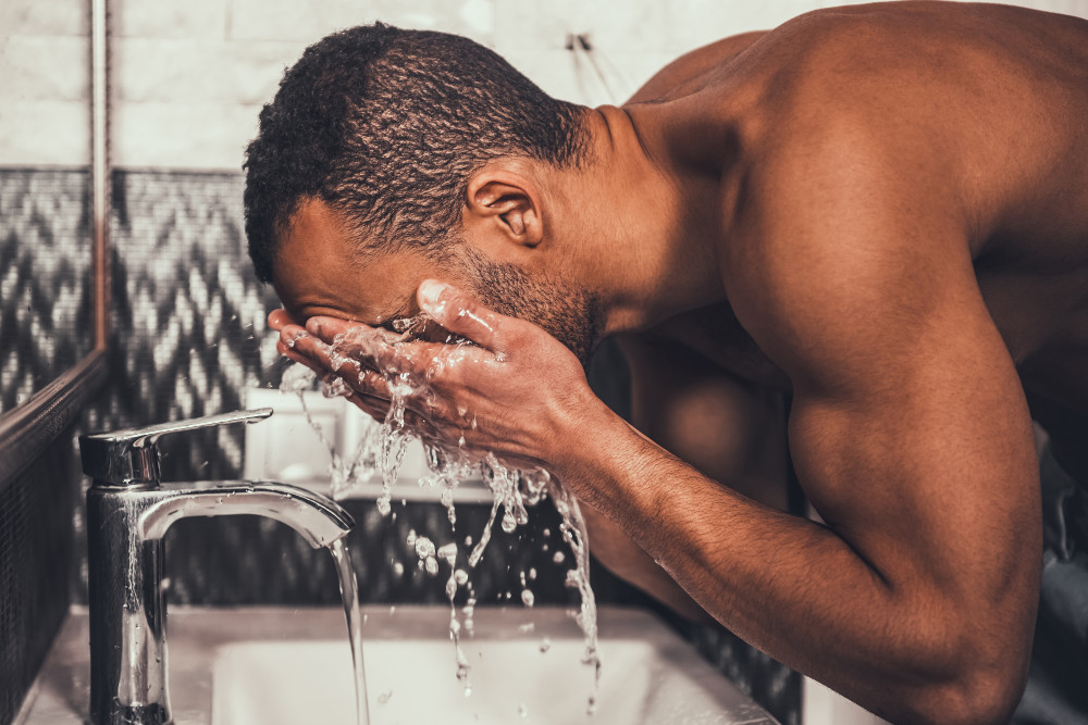 Man washing face skincare routine men