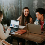 Three colleagues working together. Photographed by Brooke Cagle. Image via Unsplash