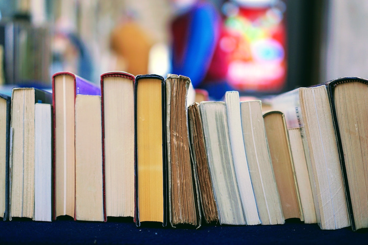 10 Best Books To Achieve Your 2022 New Year's Resolutions. Photographed by Tom Hermans. Image via Unsplash