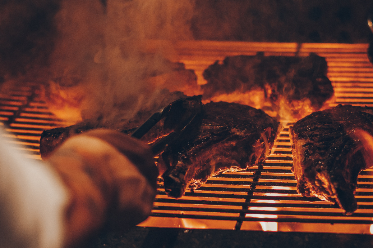 Top 8 Barbecue Tips and Tricks From a BBQ Pitmaster. Photographed by Emerson Vieira. Image via Unsplash.