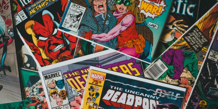 Comics and Graphic Novels arranged. Photography by Erik Mclean. Image via Unsplash