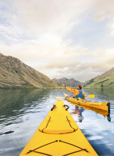 Rowing in Moke Lake Queenstown, NZ. Photography by Graeme Murray. Image via Tourism New Zealand
