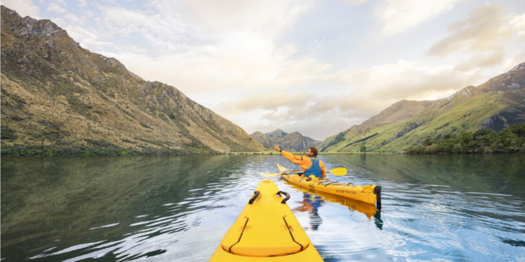 Rowing in Moke Lake Queenstown, NZ. Photography by Graeme Murray. Image via Tourism New Zealand