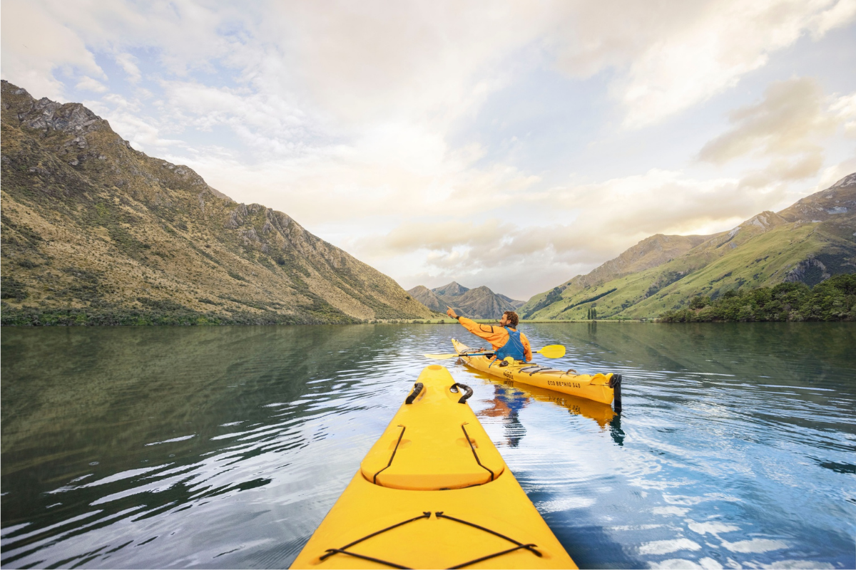 Rowing in Moke Lake Queenstown, NZ. Photography by Graeme Murray. Image via Tourism New Zealand