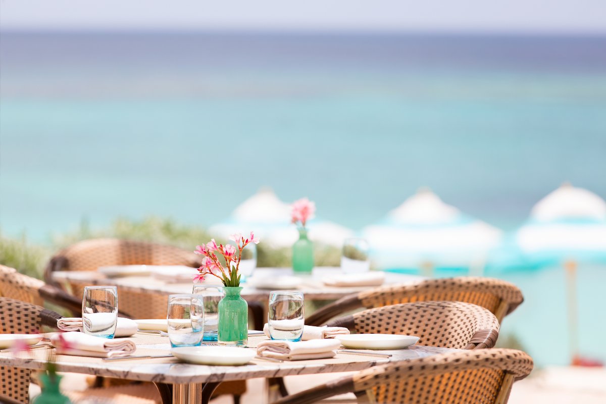 Cafe on the beach. Photography by Aleksei Potov. Image via Shutterstock.
