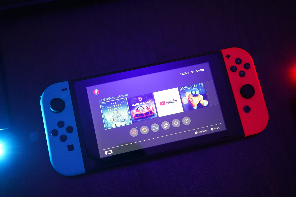 Nintendo Switch on table. Photography by Yasin Hasan. Image via Unsplash