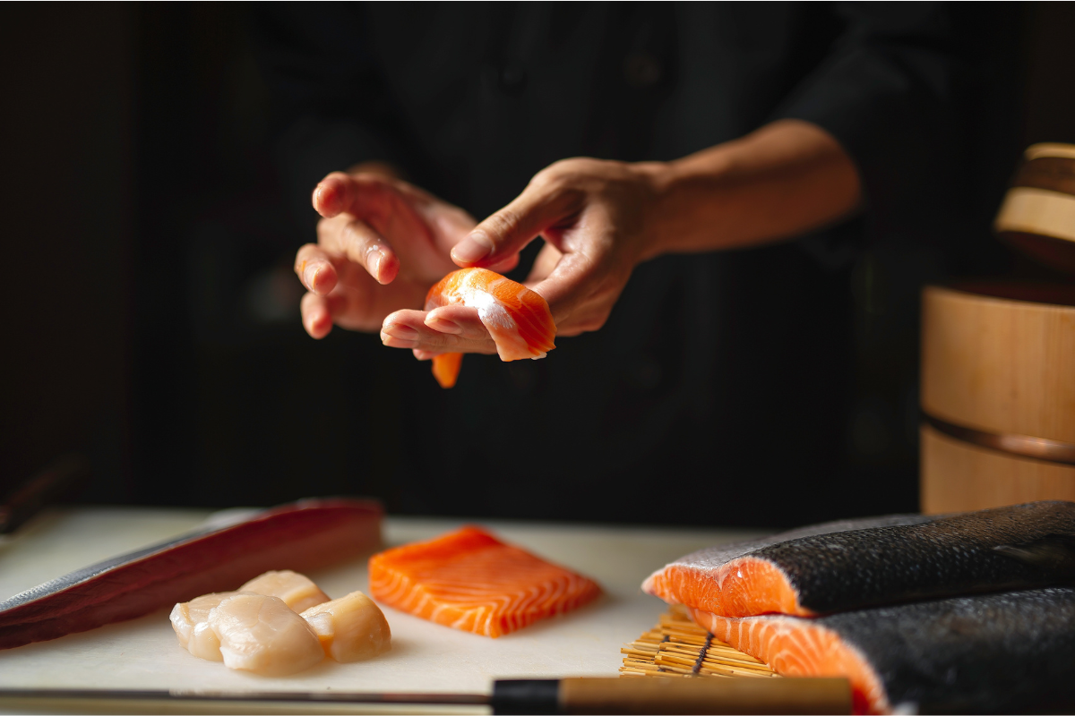 Chef preparing sushi. Photography by Chalee foodies studio. Image via Shutterstock