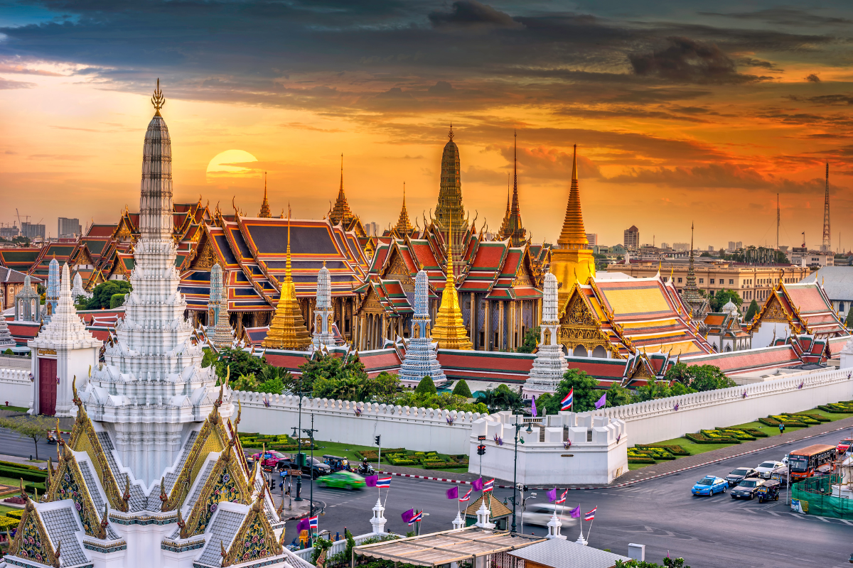 Grand palace at sunset in Bangkok, Thailand. Photography by Travel mania. Image via Shutterstock