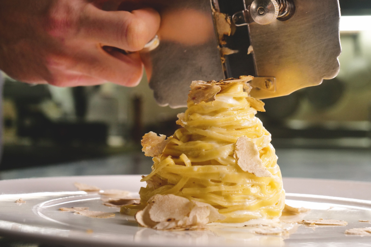 Grated truffle on top of pasta. Photography by Kitreel. Image via Shutterstock