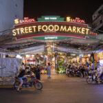 Ben Thanh Ho Chi Minh City at night. Photography by carol.anne. Image via Shutterstock