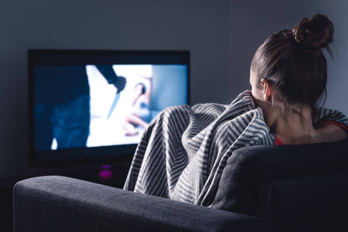 Scary horror movie on screen. Photography by Tero Vesalainen. Image via Shutterstock