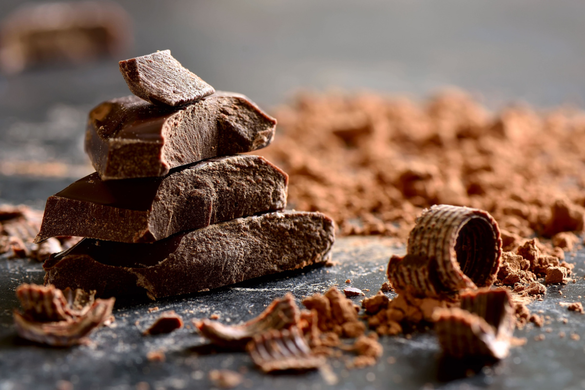 Dark chocolate, stacked. Photography by Fortyforks. Image via Shutterstock