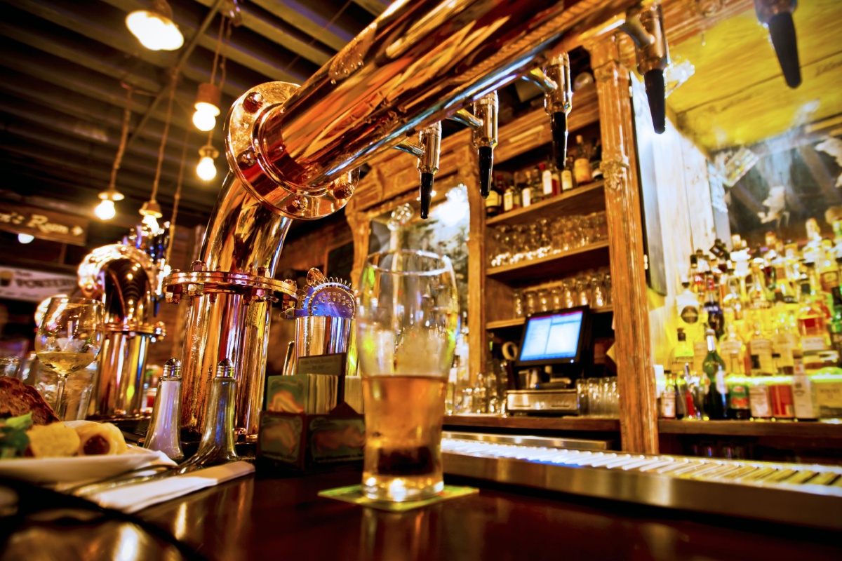 Pint of beer in traditional pub. Photography by Stuart Monk. Image via Shutterstock