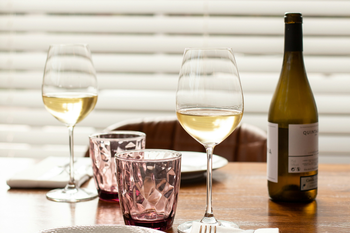 5 Must Have Wine Accessories for Your Home Bar. Photographed by Alev Takil. Image via Unsplash.