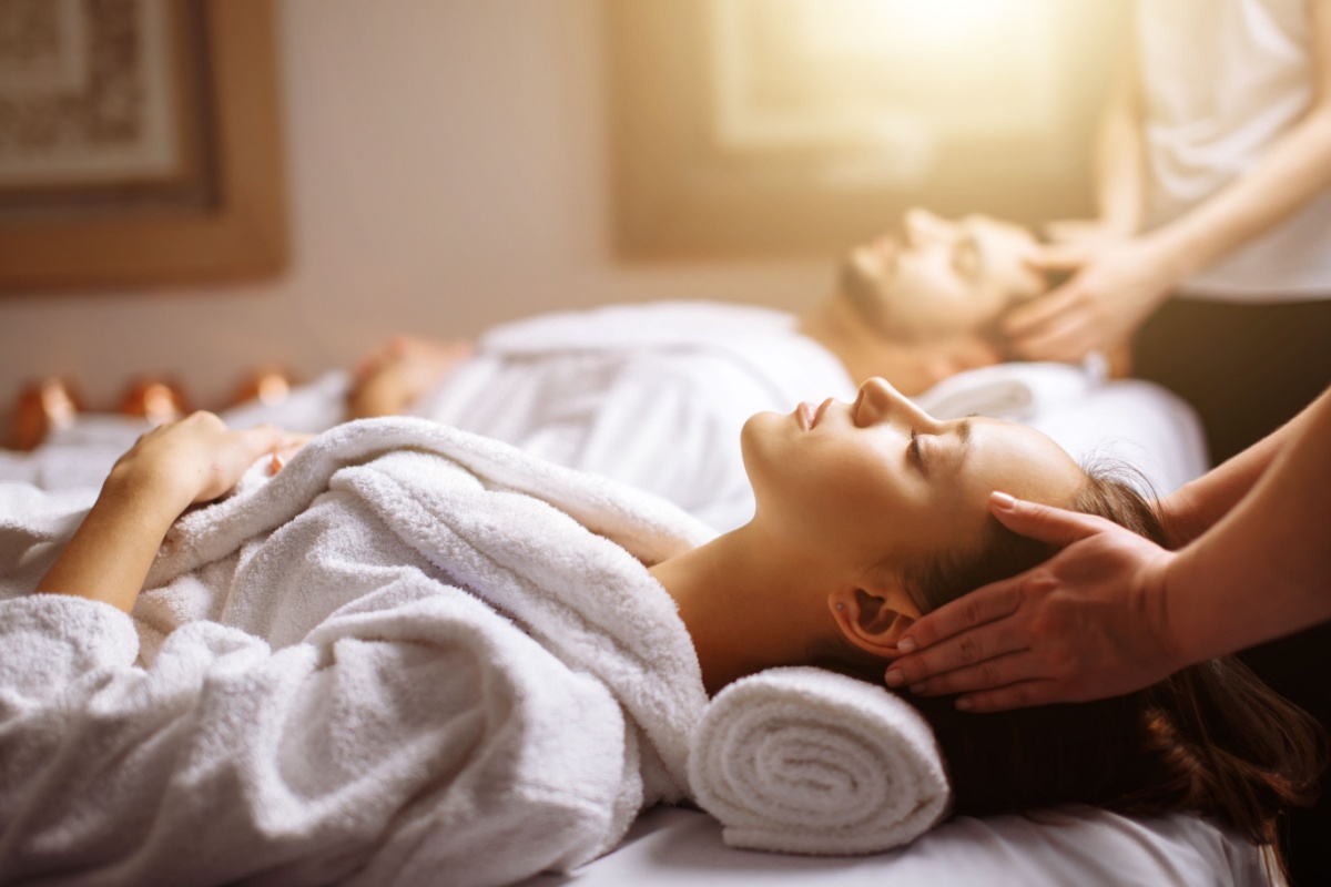 Young couple receiving massage. Photography by UfaBizPhoto. Image via Shutterstock