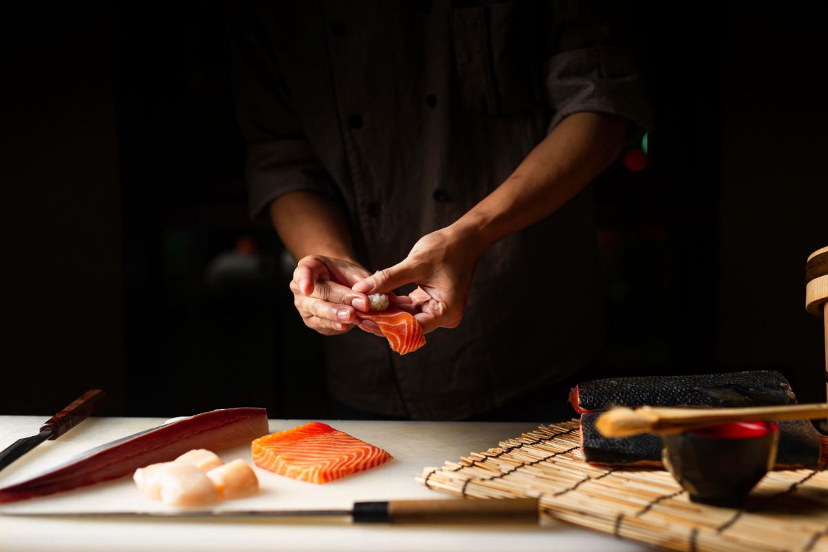 Chef preparing sushi. Photography by Chalee foodies studio. Image via Shutterstock