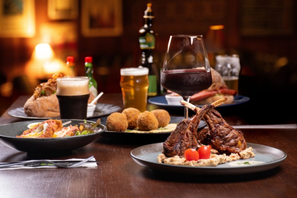 Dinner at steakhouse. Photography by Auster Pics via Shutterstock