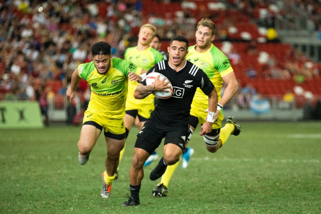 Rugby players running with ball. Photography by Mai Groves via Shutterstock