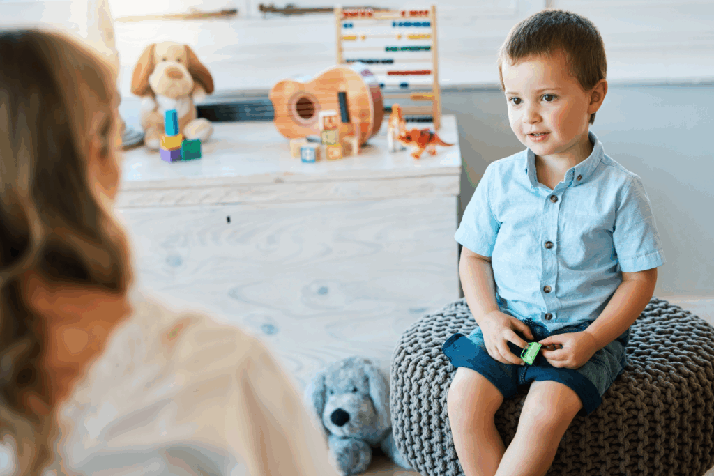Child talking to psychologist. Photography by PeopleImages.com - Yuri A via Shutterstock