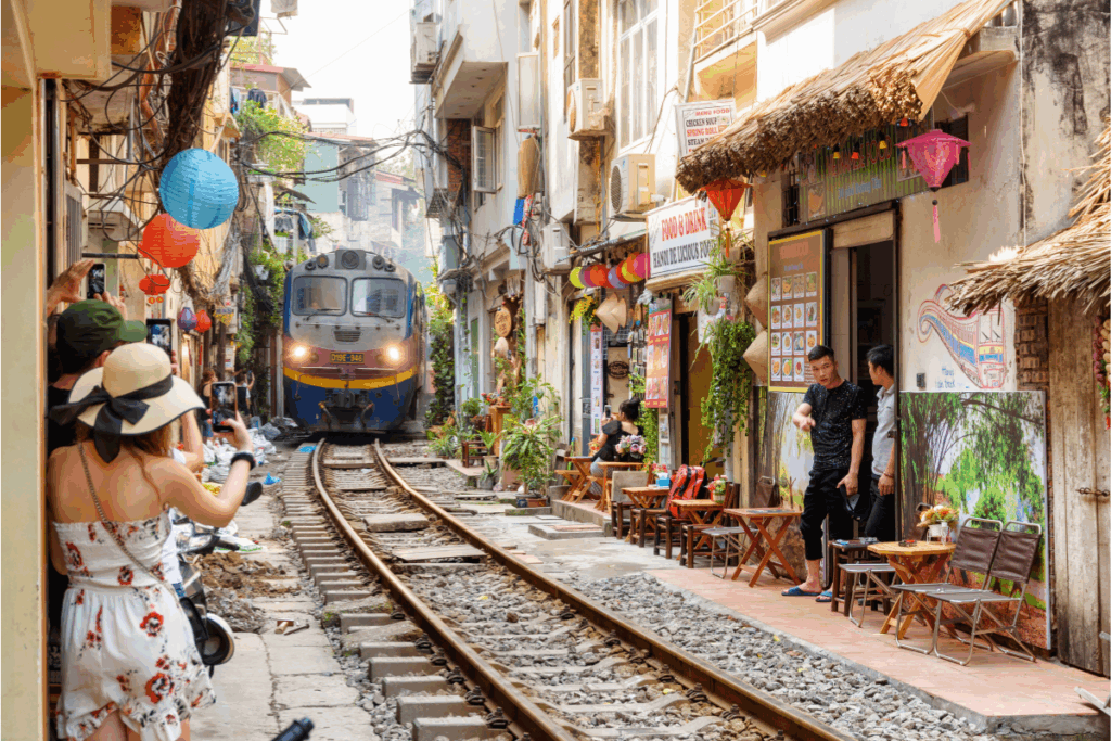Train passing through Hanoi Old Quarters. Photography by Efired via Shutterstock